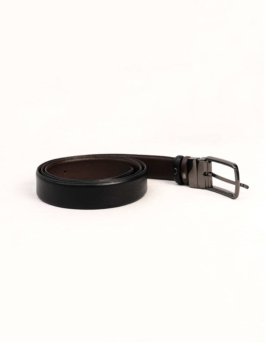 Rolled black belt showing strap and silver-tone pin buckle
