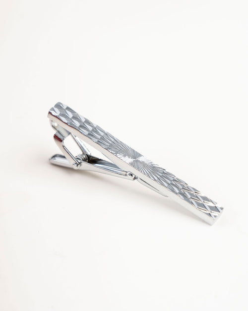 Black line gold-tone tie clip close-up