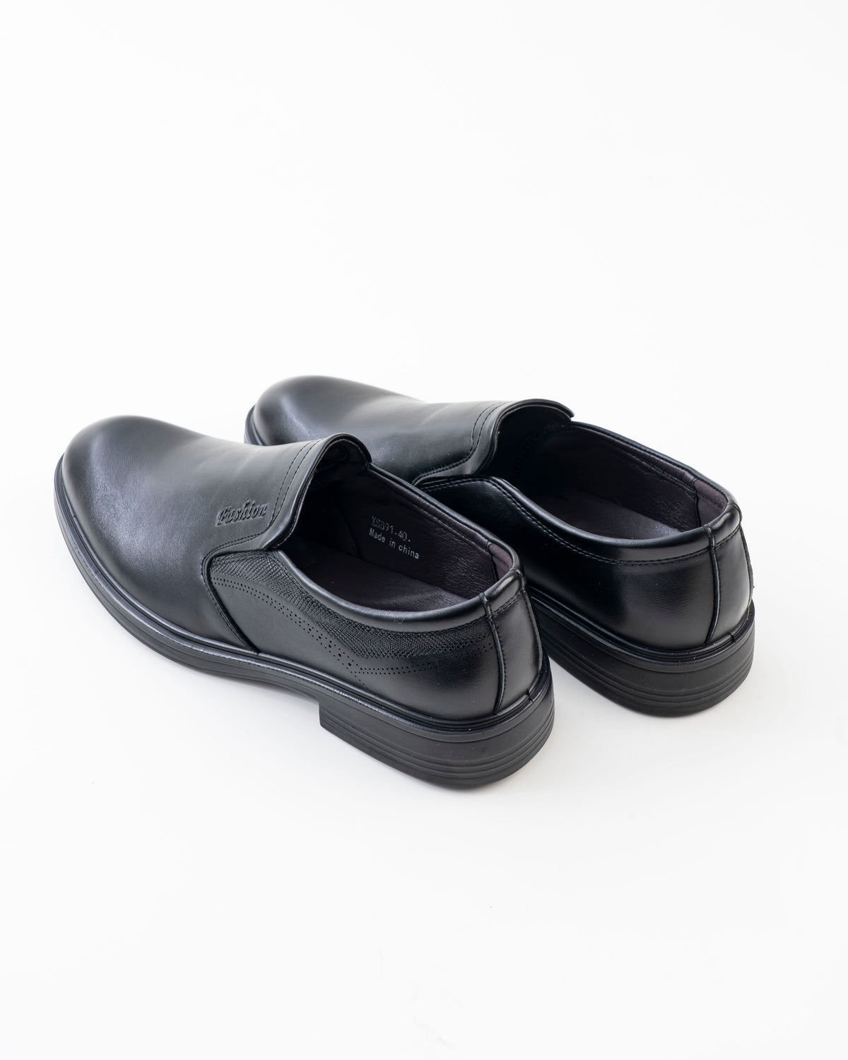 Rear view of black slip-on formal shoes