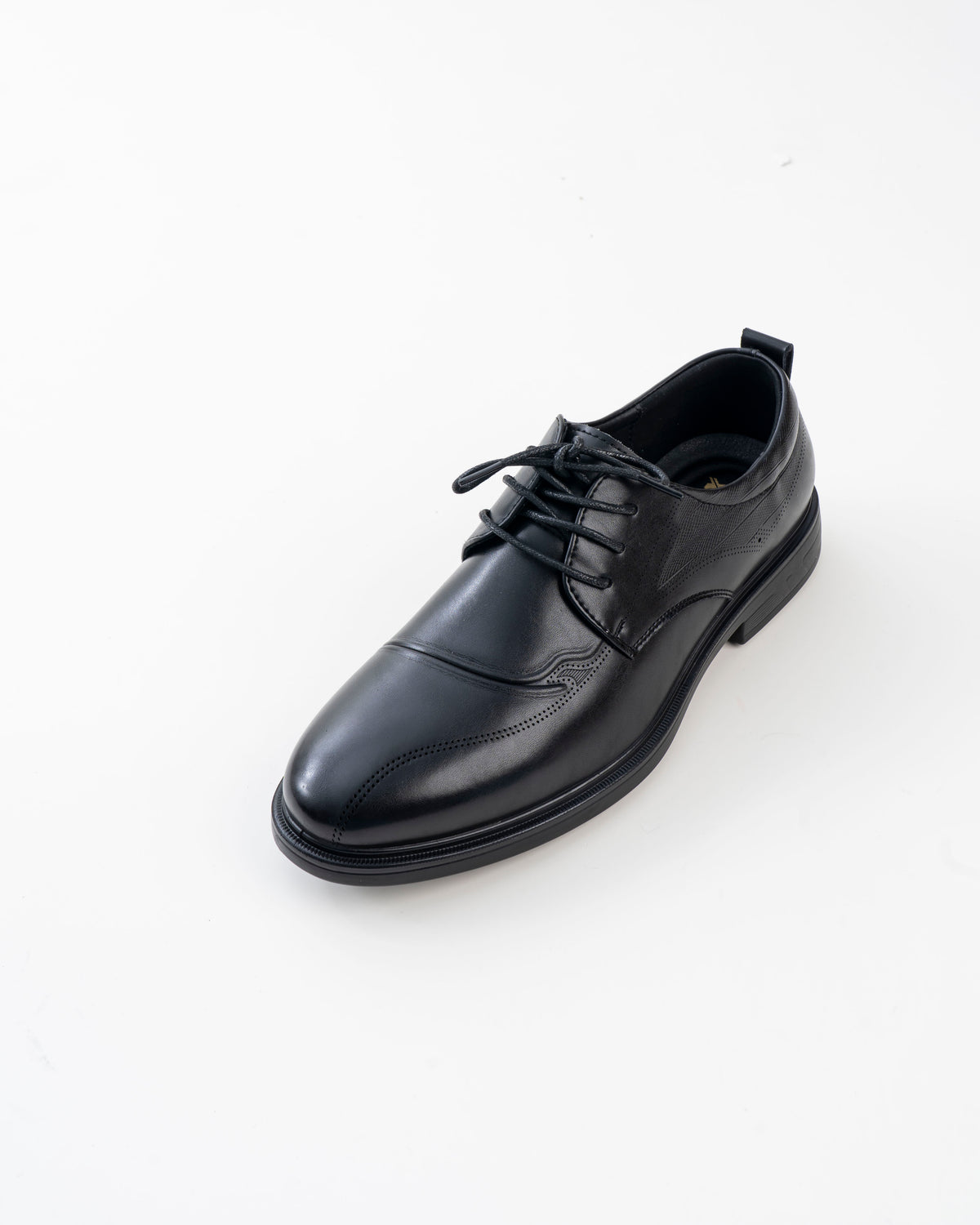 Front view of black brogue-detail formal shoe