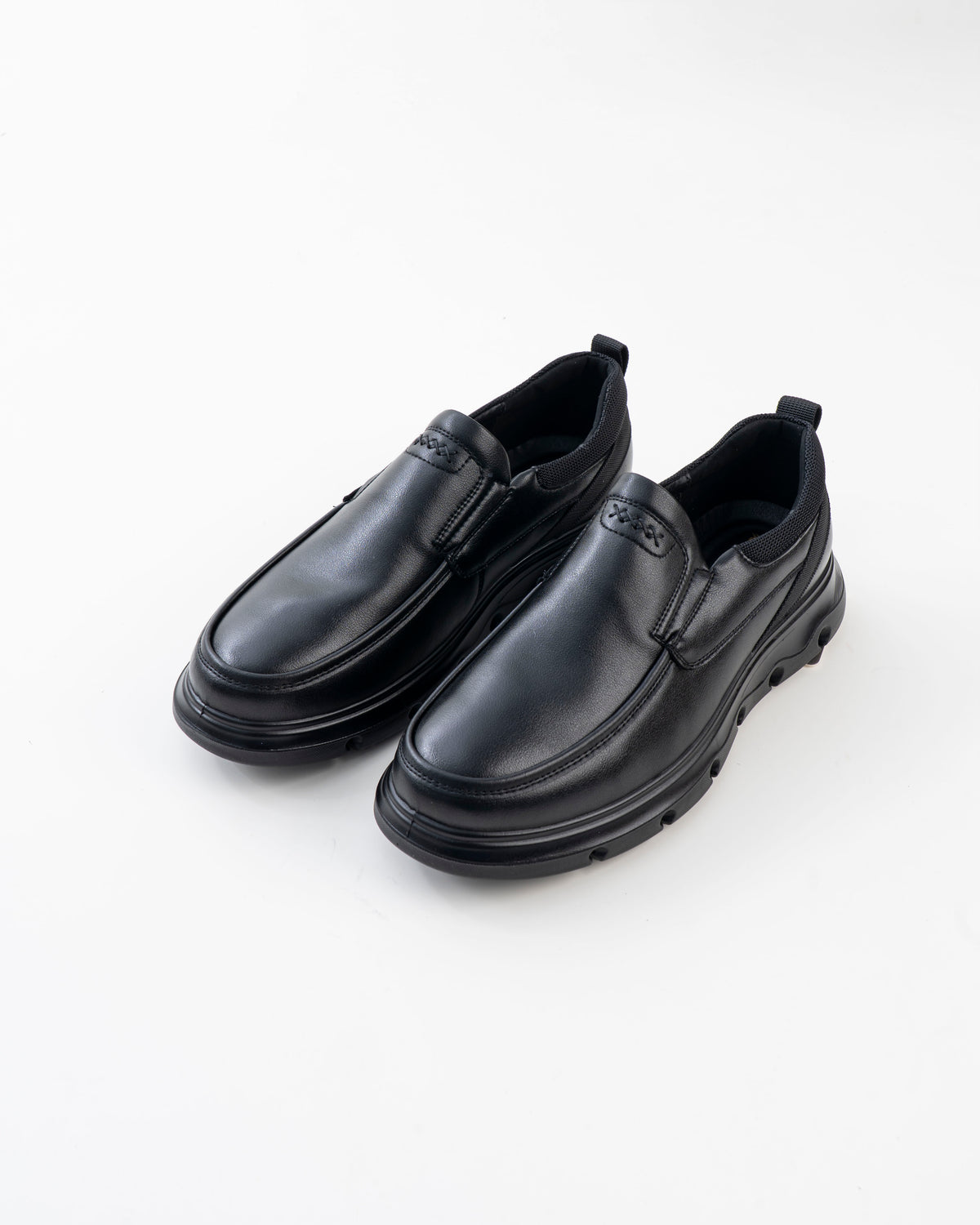 Pair of men's black chunky-sole slip-on casual shoes