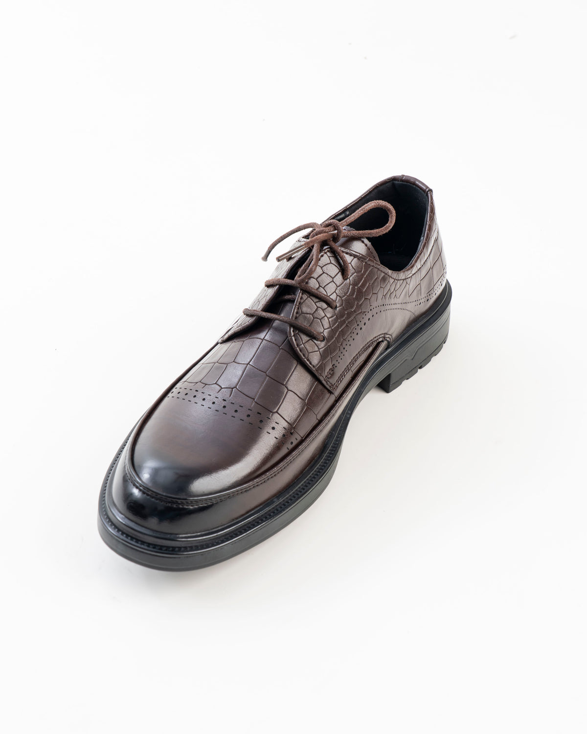 Front view of brown croc-pattern formal shoe